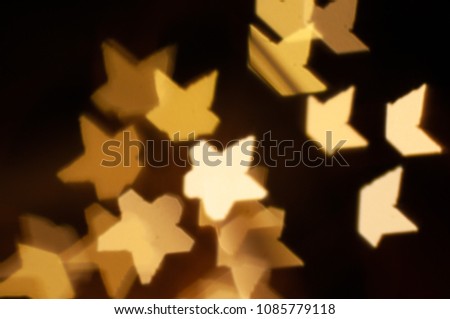 Abstract bokeh stars background of golden light burst