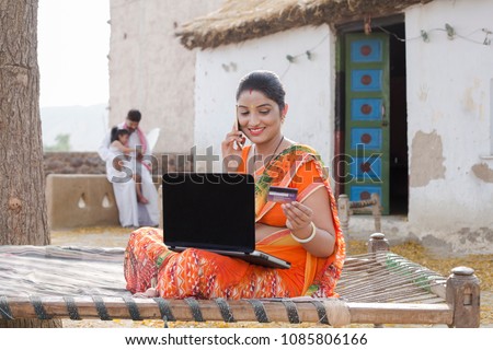  Indian woman doing online shopping at home