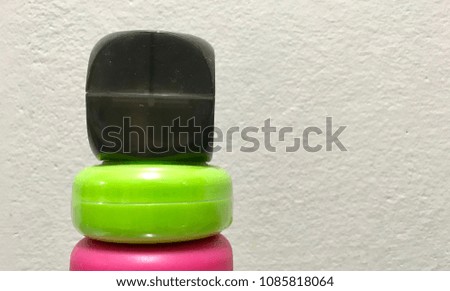 Three Colourful Plastic Pots on the White Background