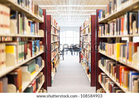 library setting with books and reading material (Please note that many books with legible titles are filler titles that only state the 'type' of materials contained within and date)