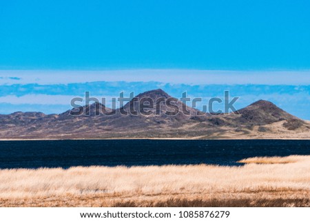Panorama of a beautiful landscape with mountain ranges and a lake in Kazakhstan