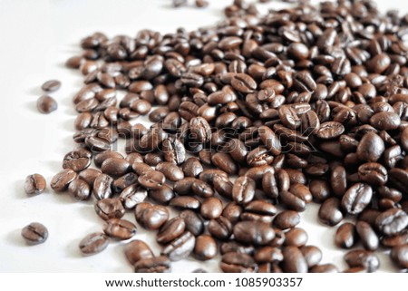 coffee beans placed on white ground