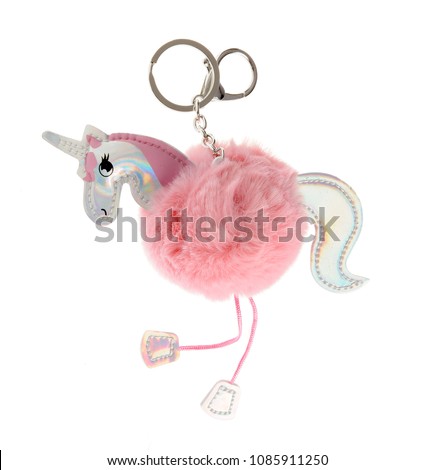 beautiful key chain luxurious fur ball-pink-colored animal isolated on white background Royalty-Free Stock Photo #1085911250