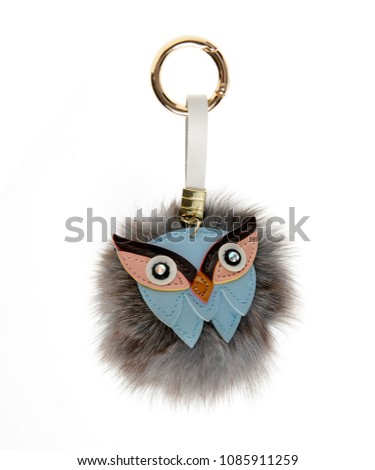 beautiful key chain luxurious fur ball-pink-colored animal isolated on white background Royalty-Free Stock Photo #1085911259