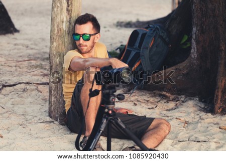People make professional photo on the tropical beach