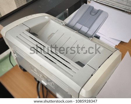 close up small desktop inkjet printer on desk 