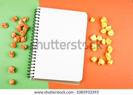 Crumpled Color paper balls and notepad. Empty space for text and design