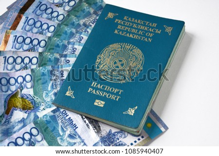 passport of Kazakhstan on money tenge background . Tenge banknote .