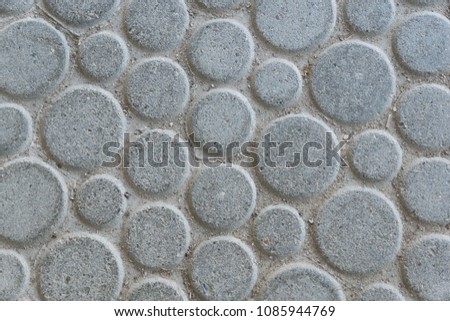 round large gray stone plates laid on the floor