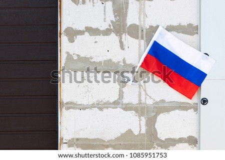 Flag of the Russian Federation at home .