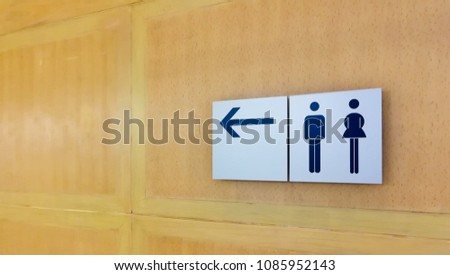 toilet sign on wood wall