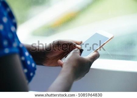 Close-up image of woman using app on her smartphone