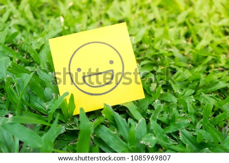 Sticky note paper with smiling face