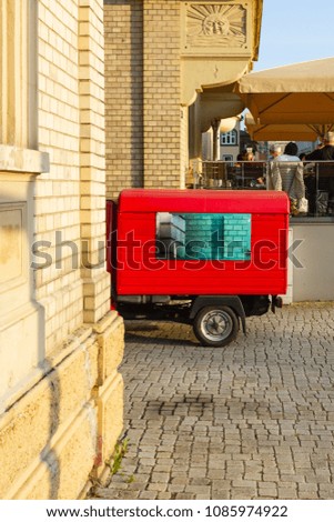 delivery car with display on springtime sunny evening