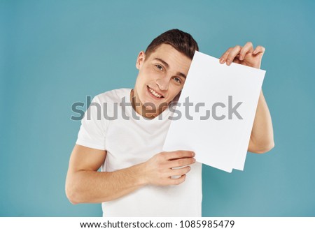 young man, sheet of paper, advertisement                             