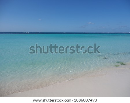 Scenic view of clean turquoise waters of Caribbean Sea landscapes at Cancun city at Quintana Roo in Mexico with horizon line and clear blue sky in 2018 hot sunny winter day, North America on March