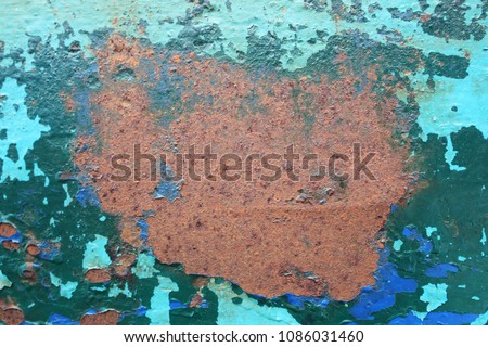 Rust on blue steel plate.