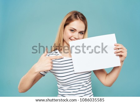 blonde holds a sheet of paper in her hand, emotions                           