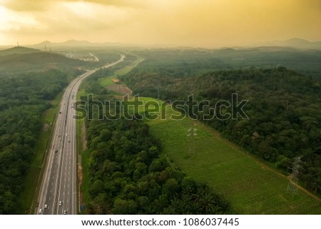 A highway that connected South and North of Peninsular Malaysia. Known as PLUS Highway. An arial view via drone on a sunset scenery. 