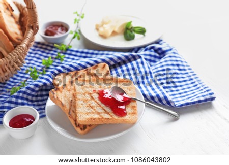 Toasted bread with jam on plate