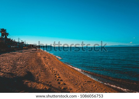 high contrasted picture of beach in the afternoon with hard shadows