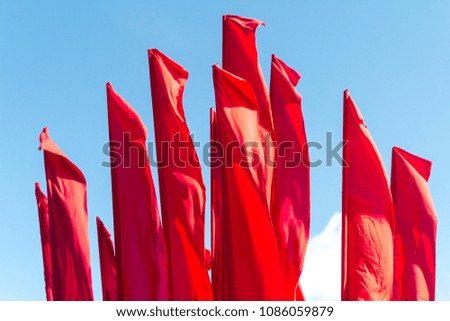 red flags against the sky