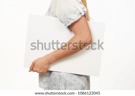 Female hands holding blank sheet of paper isolated on white.