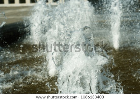 Fountain water jet splashing.