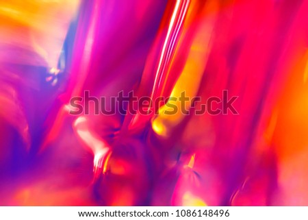 Abstract digital intense night club background of multicolored vibrant festive smooth orange and magenta colors with blurred fluid lights