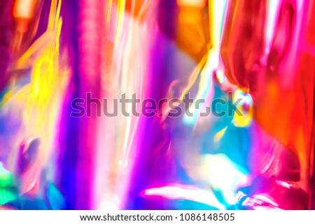 Abstract vivid wallpaper of holographic vertical lens flare neon lights with spectrum psychedelic saturated neon colors and shiny glowing reflections Royalty-Free Stock Photo #1086148505