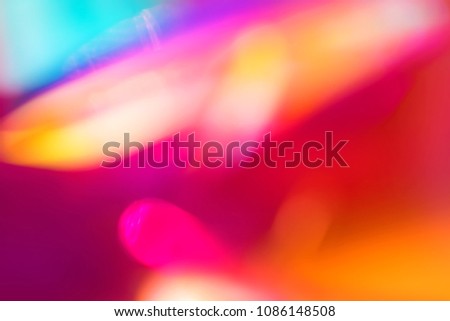 Abstract holographic smooth funky party background of soft lens flare lights with gradient vivid blurry neon colors Royalty-Free Stock Photo #1086148508