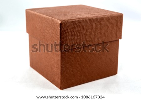 Small square box made from textured paper isolated on white background