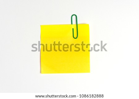 Clip paper and paper note on white background.