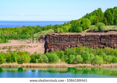 Rock Wall in an old quarry with a lake