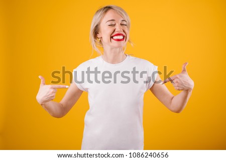 Silly smiling funny woman in white t-shirt where you can place ypur logo text or image.