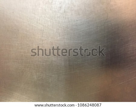 Sheet metal or stainless steel sheet with scratches.