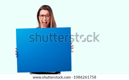 young pretty woman, expresive face, holding a placard. empty space to place your concept