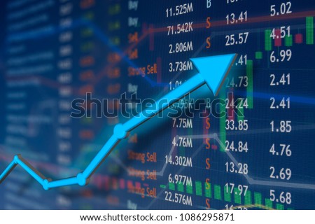 Stock market rise with blue arrow and faded candlestick charts.  Winning and success emotion and happiness.