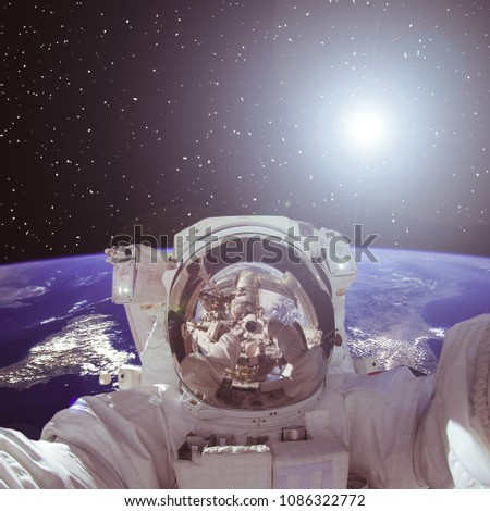 Astronaut and deep space beauty, earth. The elements of this image furnished by NASA.