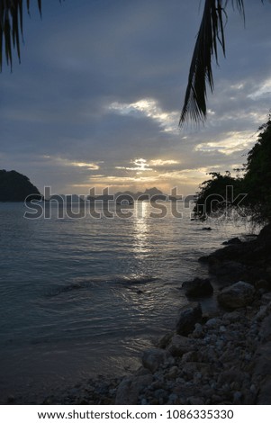 Sunset beach and a girl in one of the Philippines islands 