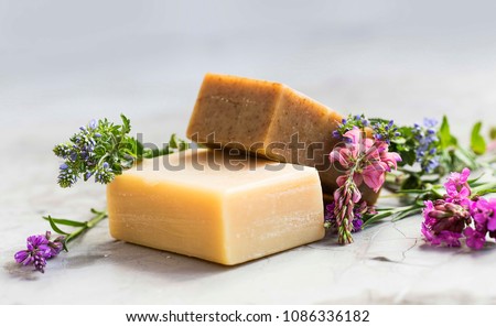 Natural handmade soap bars with flowers, spa organic soap Royalty-Free Stock Photo #1086336182