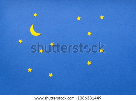 Handmade paper cut starry sky, blu sky with yellow stars.  Royalty-Free Stock Photo #1086381449