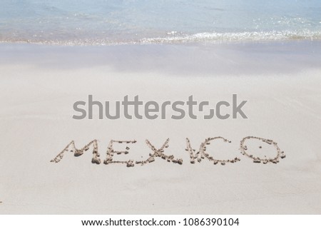 Inscription Mexico on the beach
Letters on the sand. Summer concept of sandy beach. Space for text