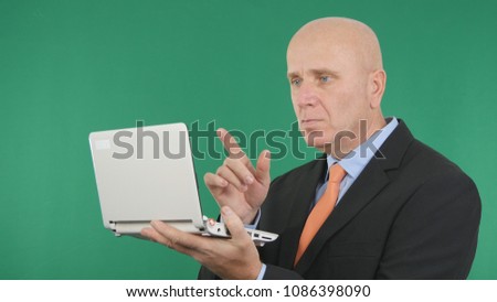 Businessman Image Working Use a Laptop and Gesticulate Pointing With Finger