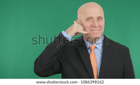 Smiling Businessman Make Call Me Hand Gestures