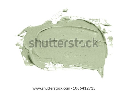 Cosmetic mud mask smear isolated on white background. Top view, closeup texture of blue facial clay, copy space Royalty-Free Stock Photo #1086412715