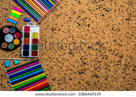 School and office supplies on a background of cork tree. Top view with copy space. Back to school
