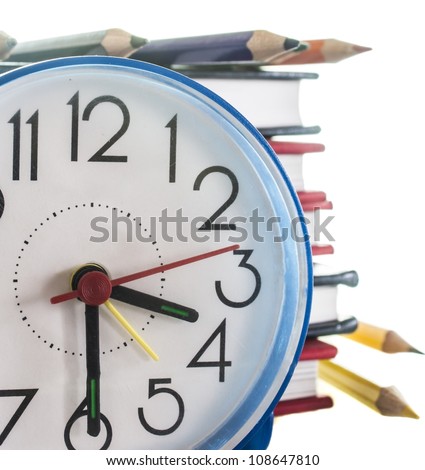 school composition,pencils, books and clock, isolated on white