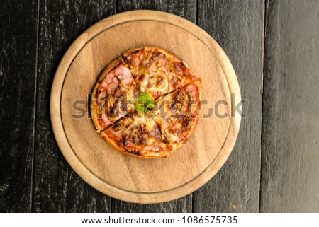 Pizza in wood plate