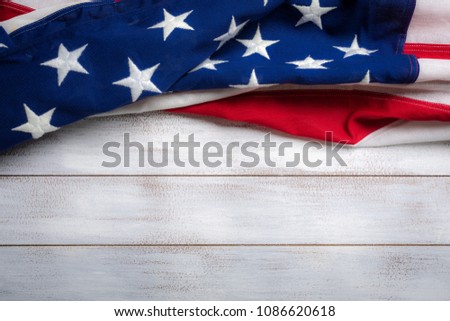 United states flag on white, weathered clapboard background with copy space
